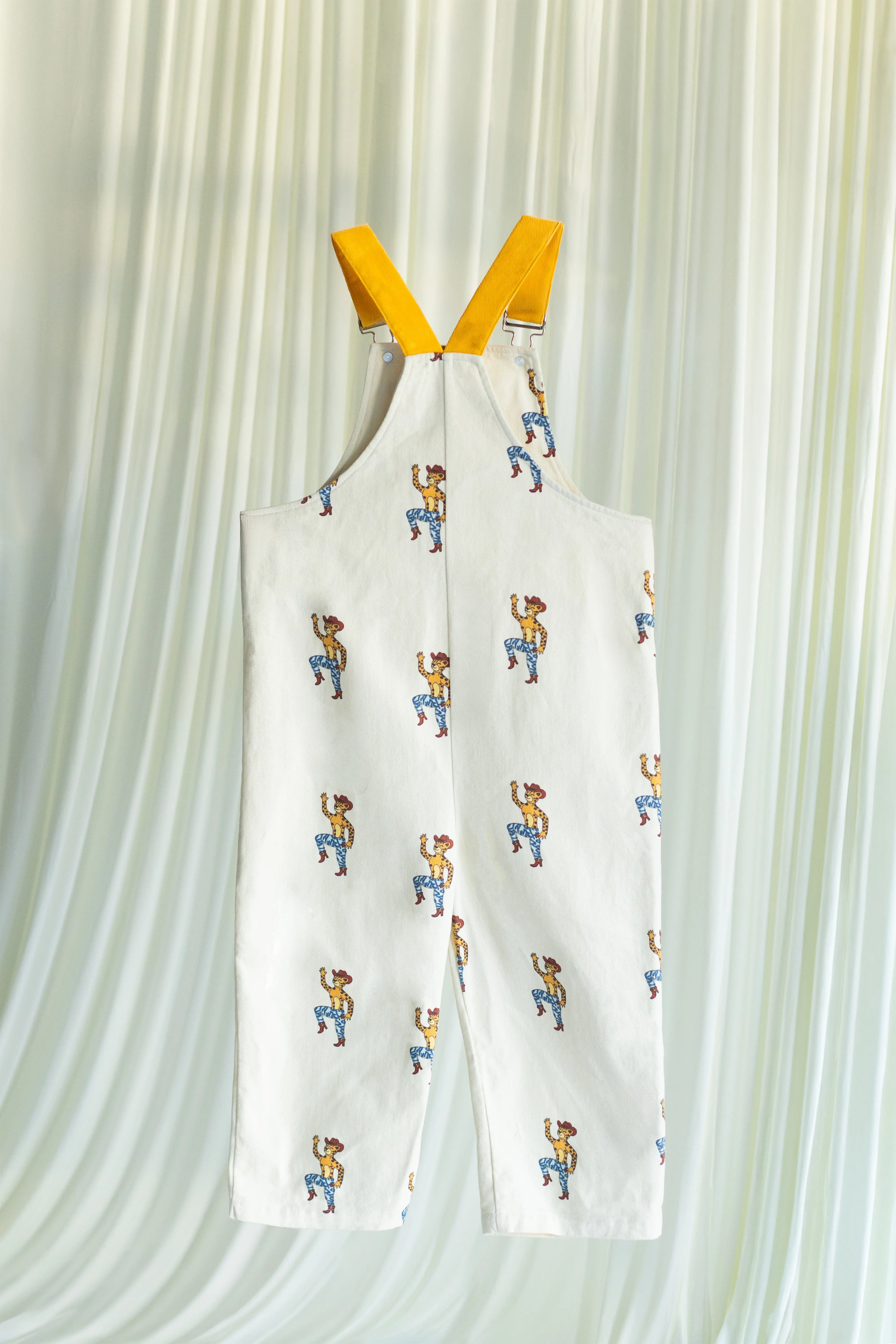 White overall with cartoon pattern on a white background