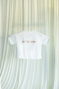 White t-shirt with 'DON'T TELL MOMMY' text on a textured white background