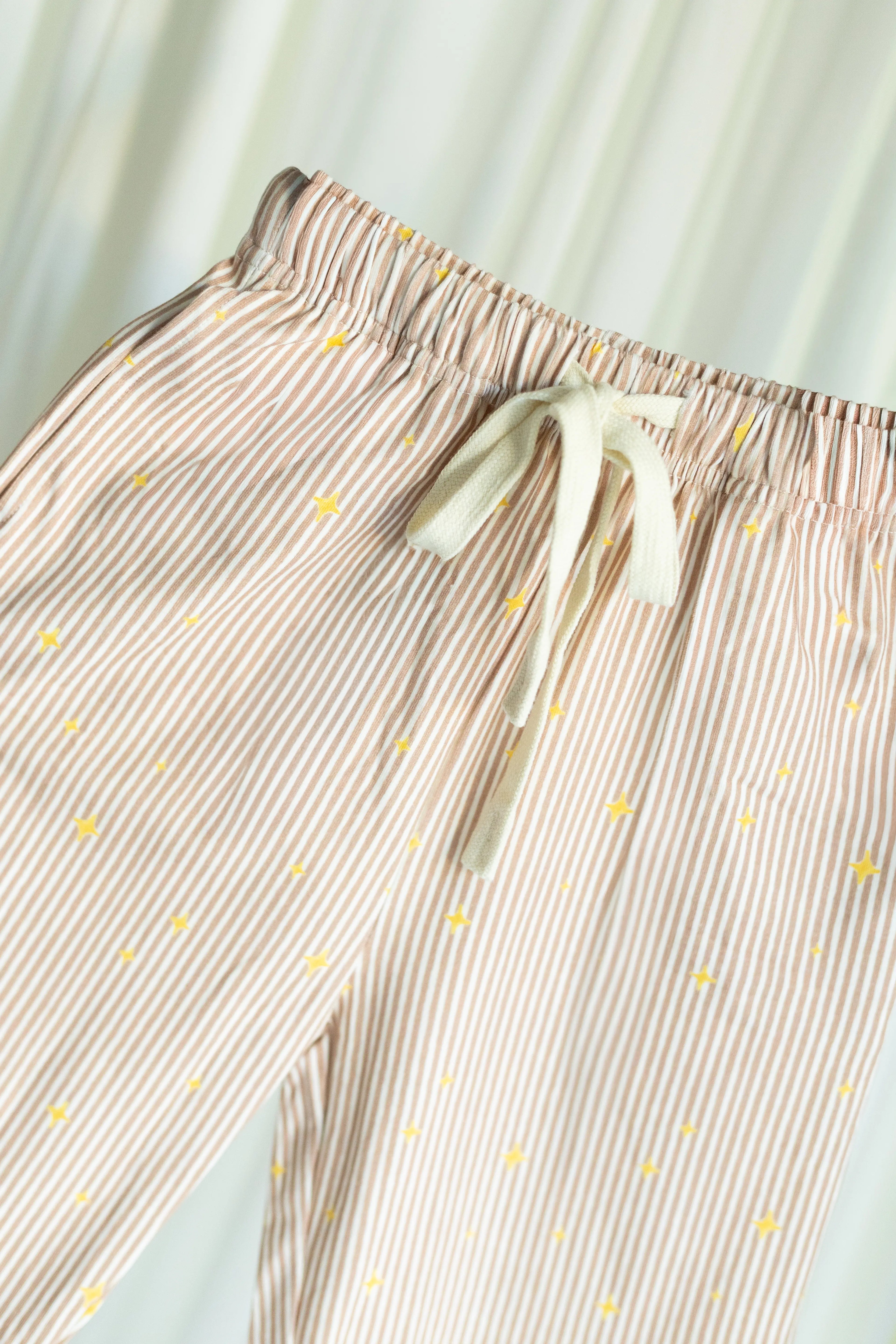 Little Stars Pants on a light white curtain background